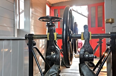 The brake van. The guard used to wind the brakes in on springs so the pads would slow on the centre raised rail.