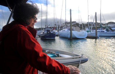 Fiona keeping the dinghy away from the prop in the marina