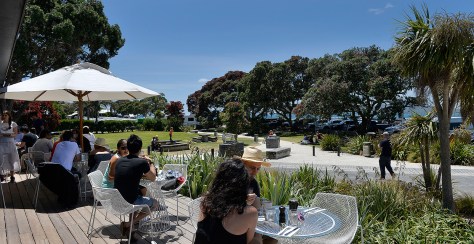 People enjoying lunch with the campground behind