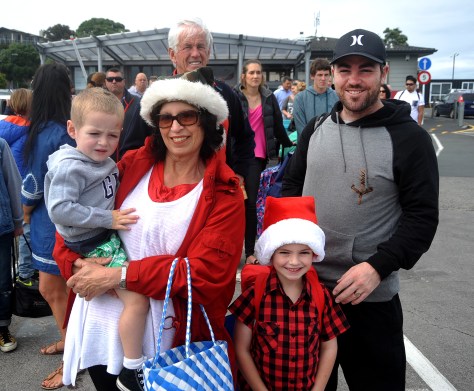 Waiting for the ferry at Half Moon Bay. Liam with Fiona and Ayden with his dad Alex.