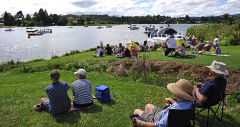 The crowd enjoying the Parade. Commentary boat on the right