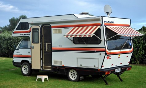 The van with all its colourful awnings.