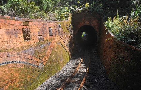 A train coming through the tunnel with Barry's tiles