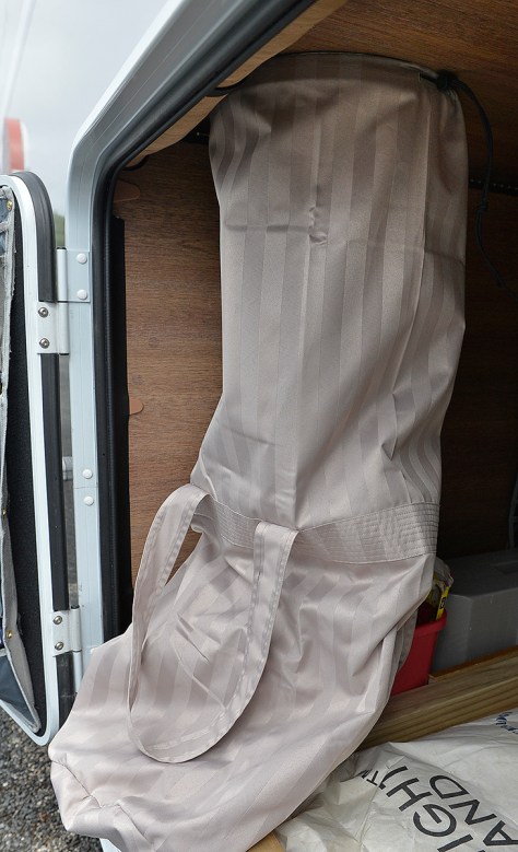 The chute in the garage with the detachable bag.