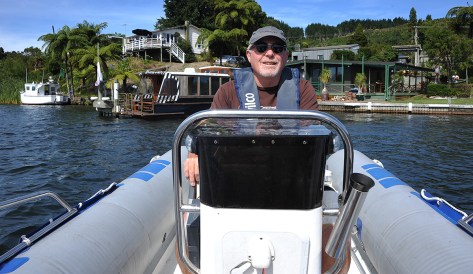 Alan on the helm with Frasers house behind