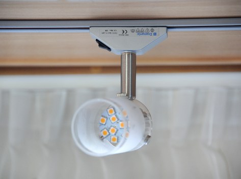 The screws for the glass at the waist of the light.